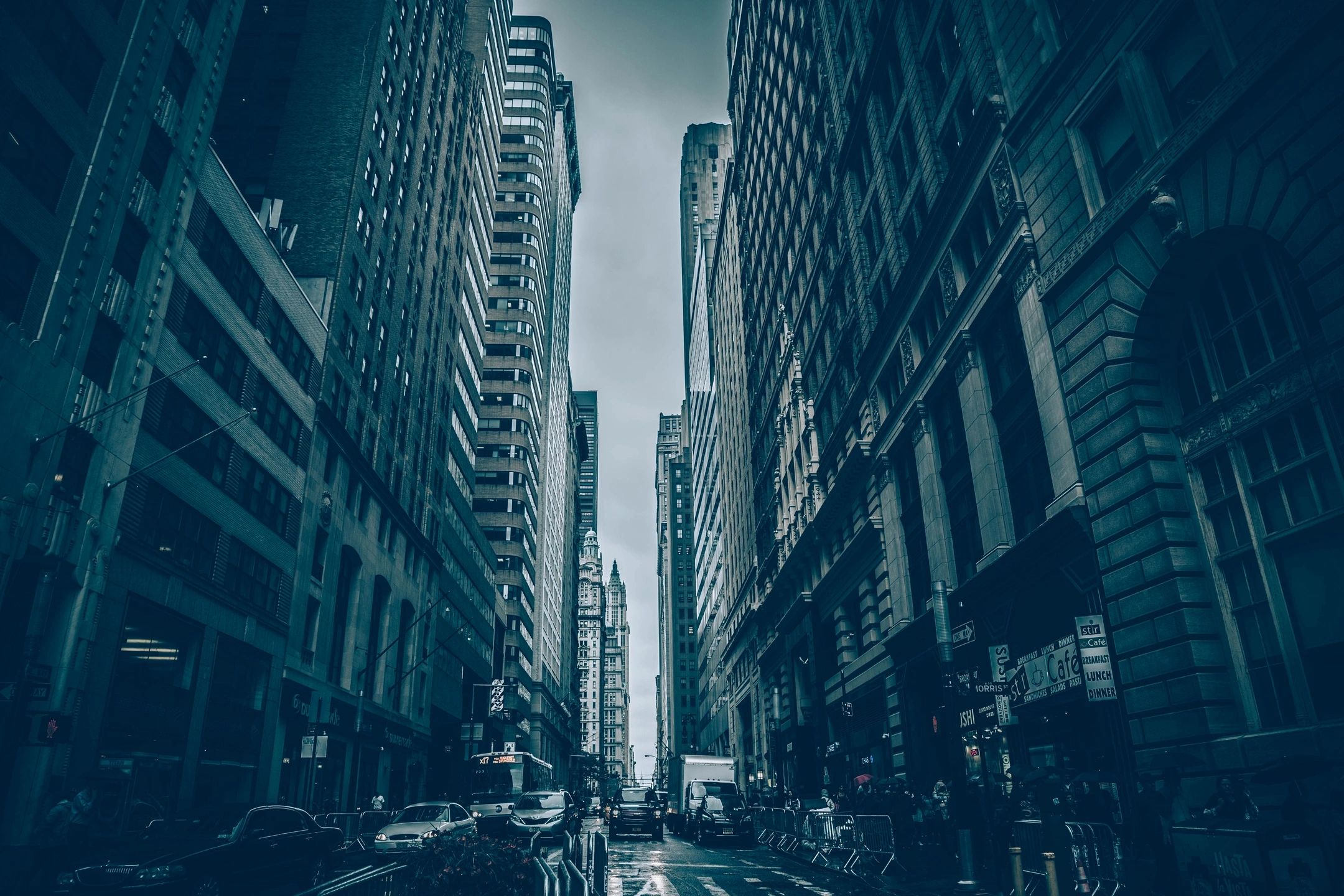 City street lined with tall buildings in a major American metro area