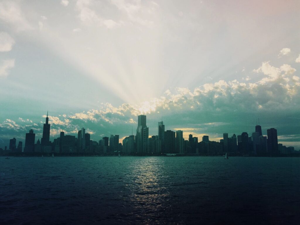 City skyline at dusk across the water in a major US metro area
