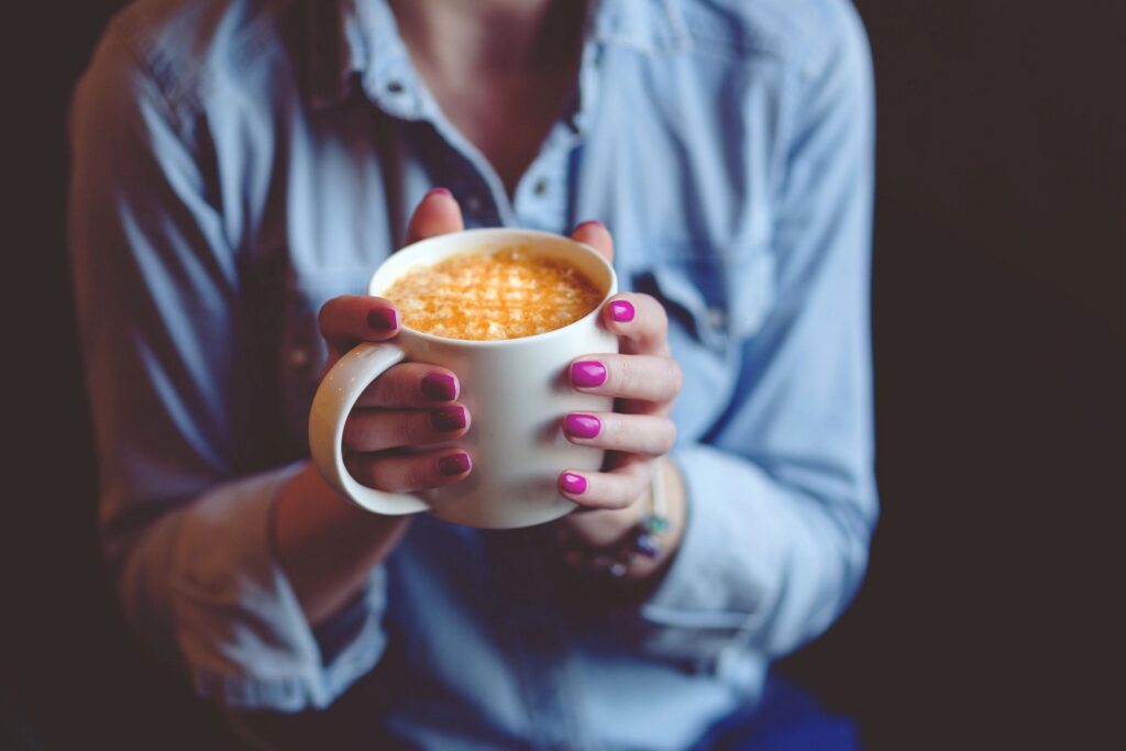 Cup of spiced coffee served on a wooden table